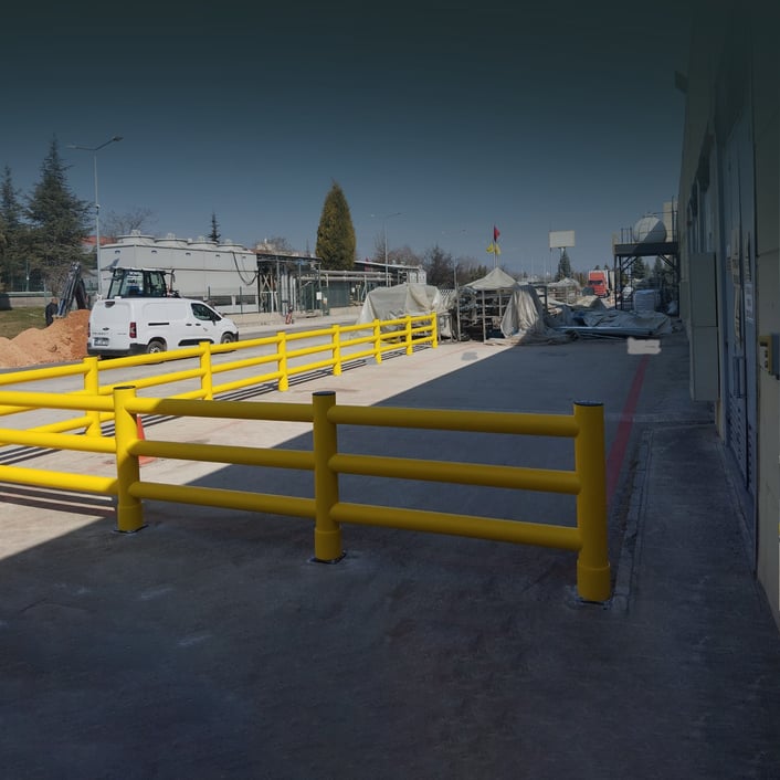 Polymer safety barriers separating a pedestrian walkway from an FLT route at a UK warehouse loading bay