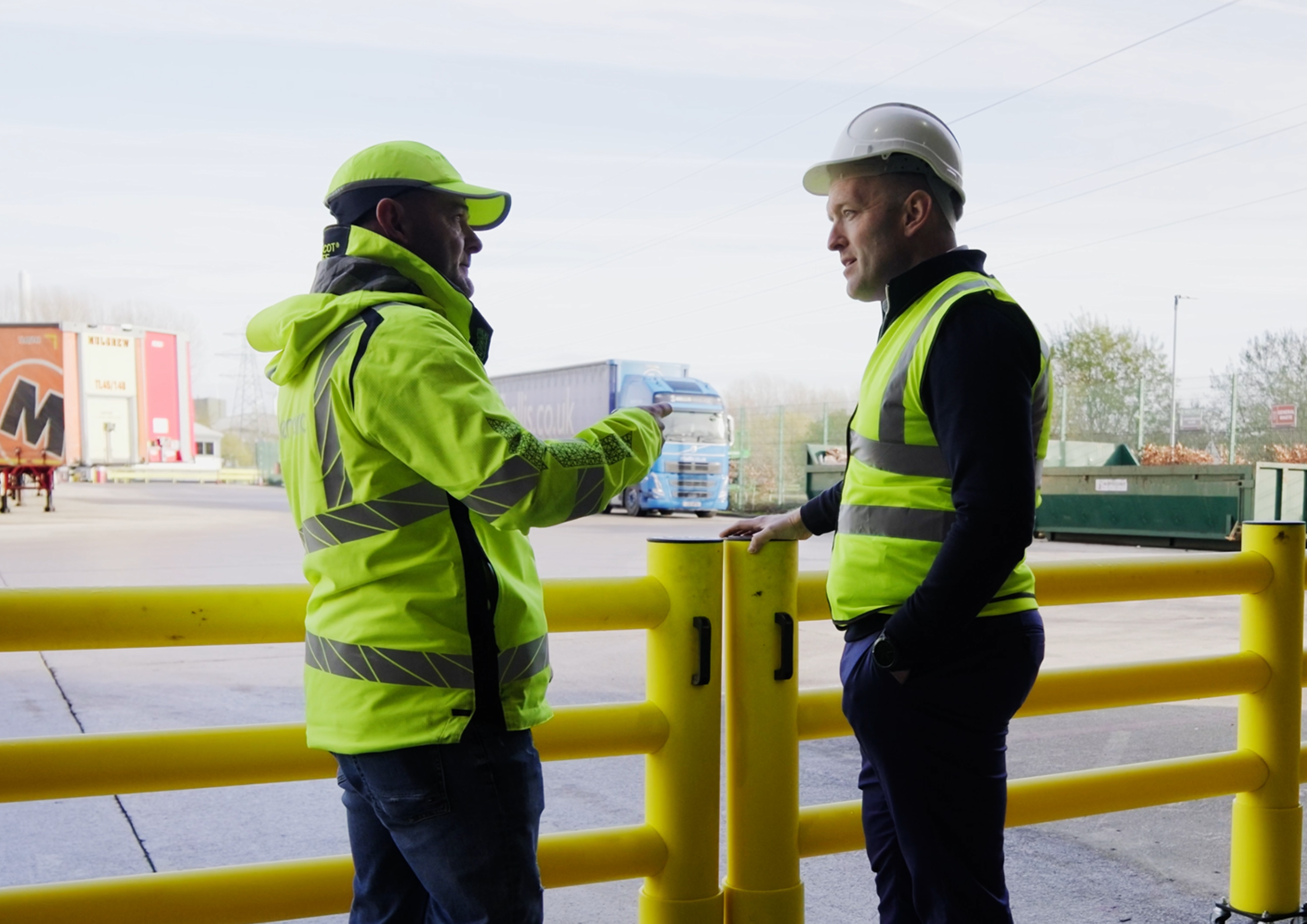 Safety auditor conducting warehouse inspection of pedestrian barriers and FLT routes