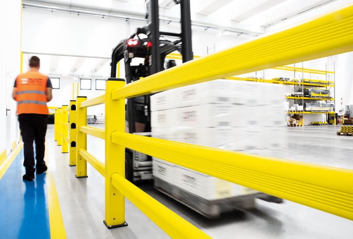 PAS 13 tested polymer barrier protecting warehouse team