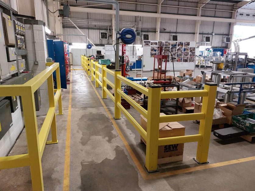 Polymer safety barriers installed in UK warehouse protecting pedestrian walkway