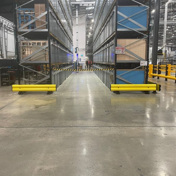 Impact-resistant racking protectors fitted to warehouse shelving in UK facility