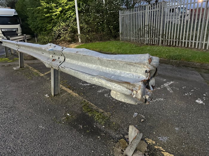 Steel barrier crumpled after forklift collision