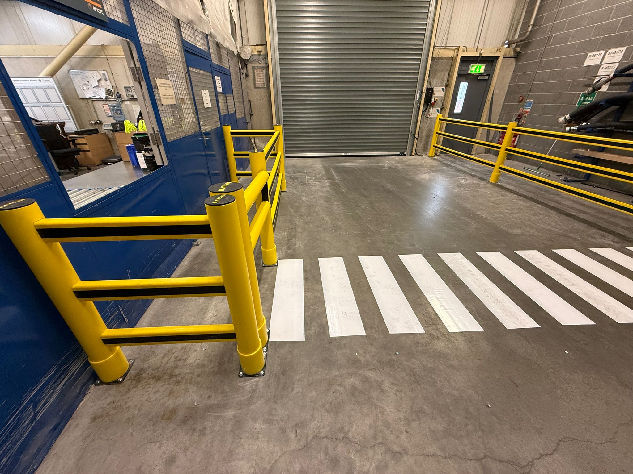 pedestrian crossing with polymer barriers at controlled crossing point