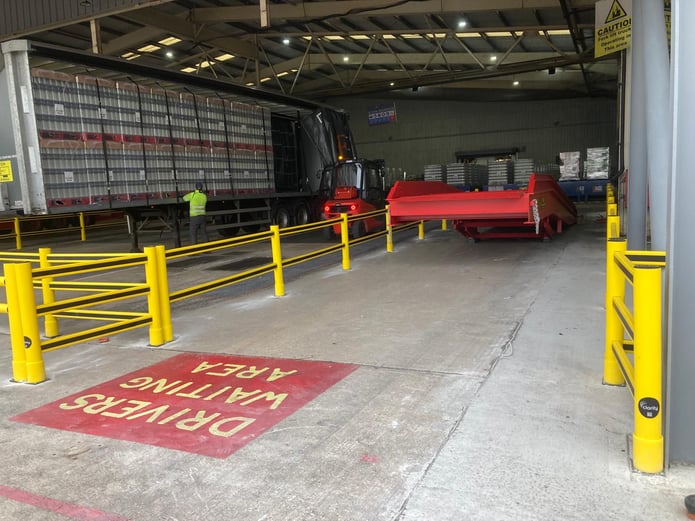 Polymer safety barriers protecting a warehouse loading area