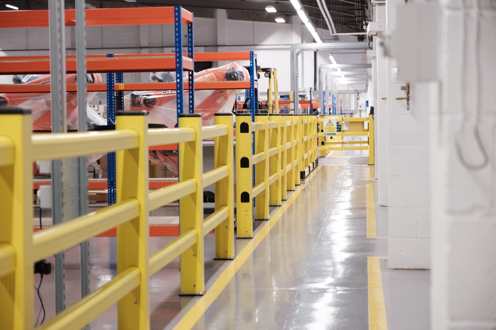 Yellow flexible polymer barrier which can absorb forklift impact