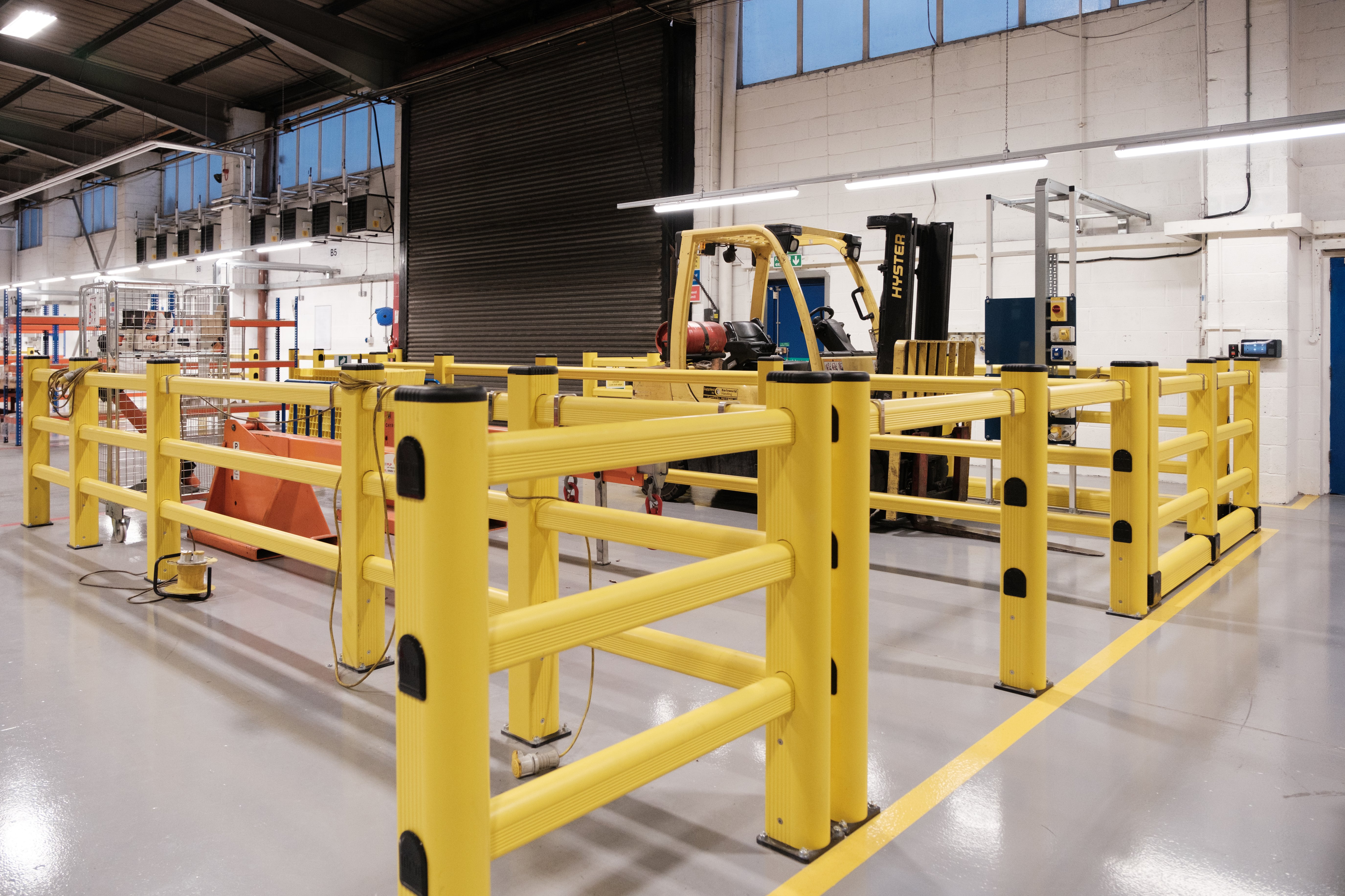 Budget-friendly barrier installation protecting forklift routes in a UK warehouse