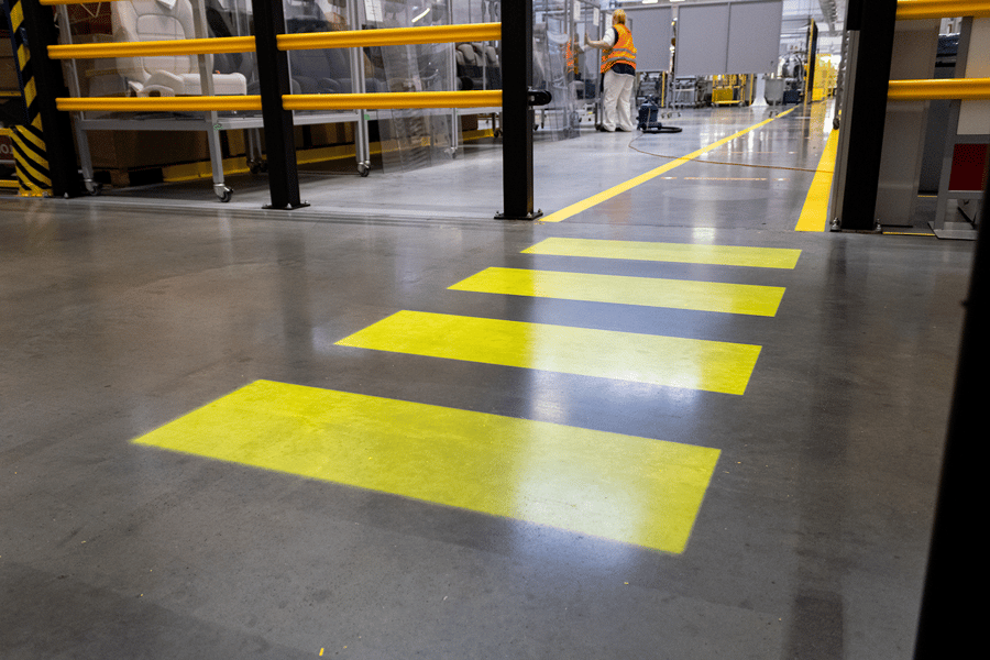 Warehouse pedestrian crossing with motion-activated LED projection
