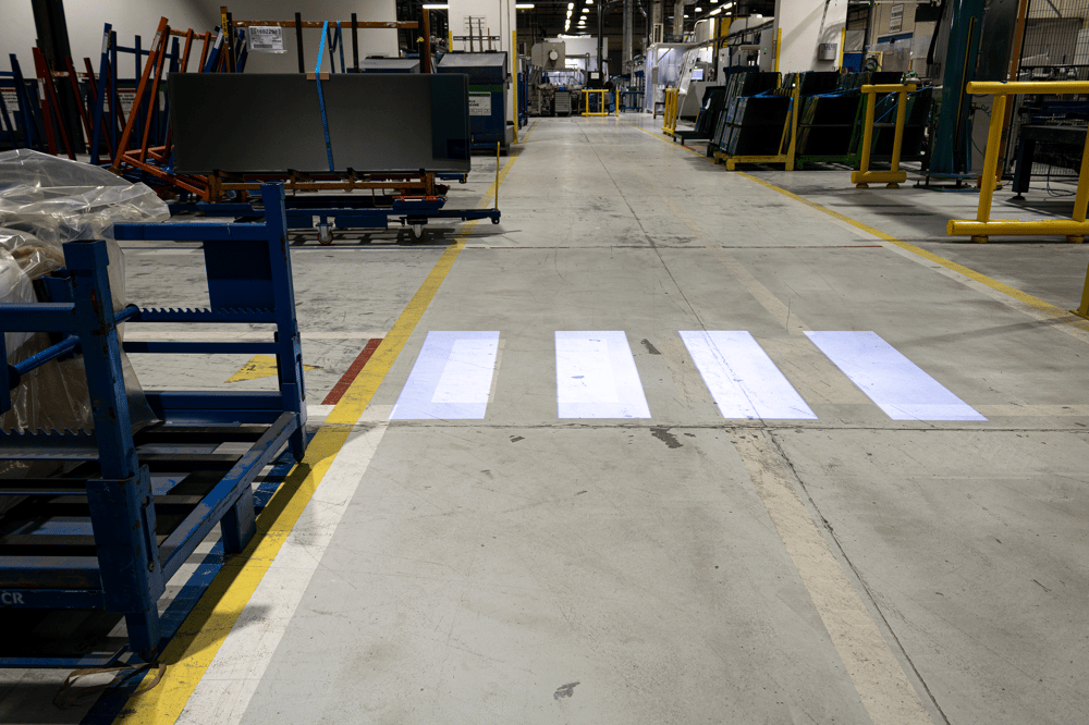 Clarity Safety LED projected floor marking illuminating pedestrian walkway