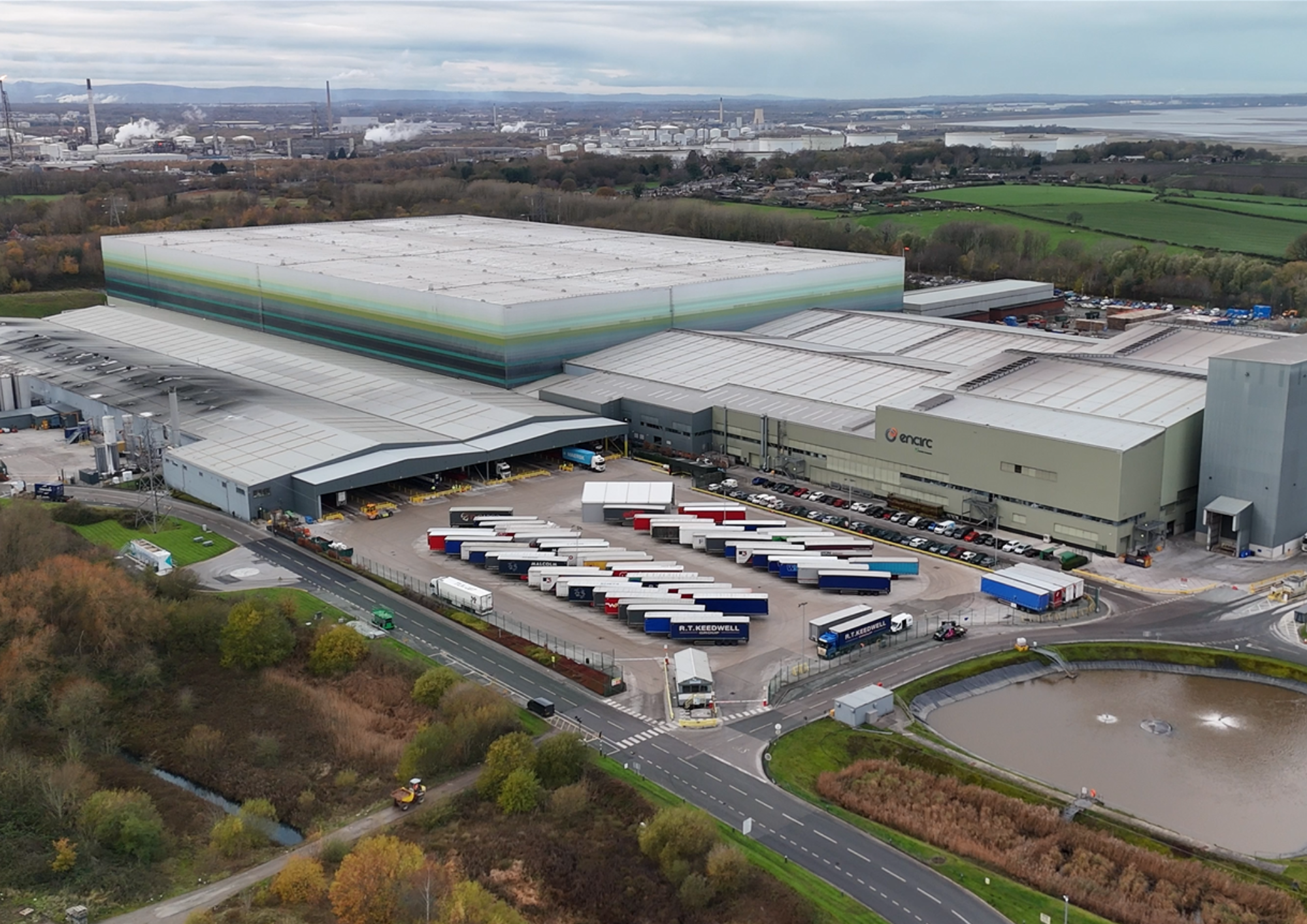 •	High-level topple barrier protecting a pedestrian walkway from stock stacked at height