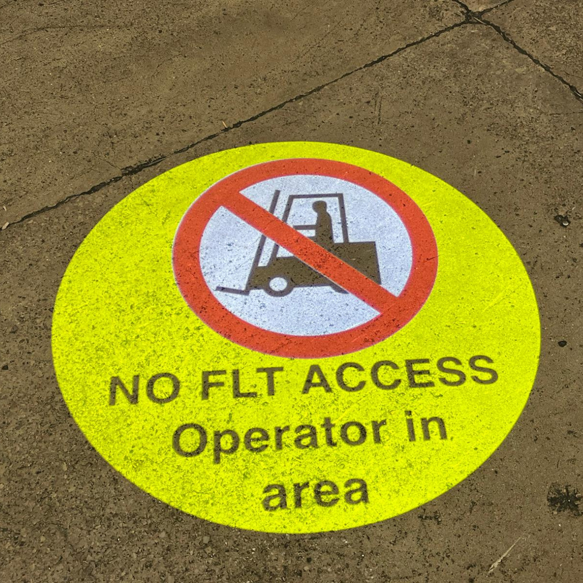 Projected LED warning sign restricting FLT entry to pedestrian zone in UK warehouse