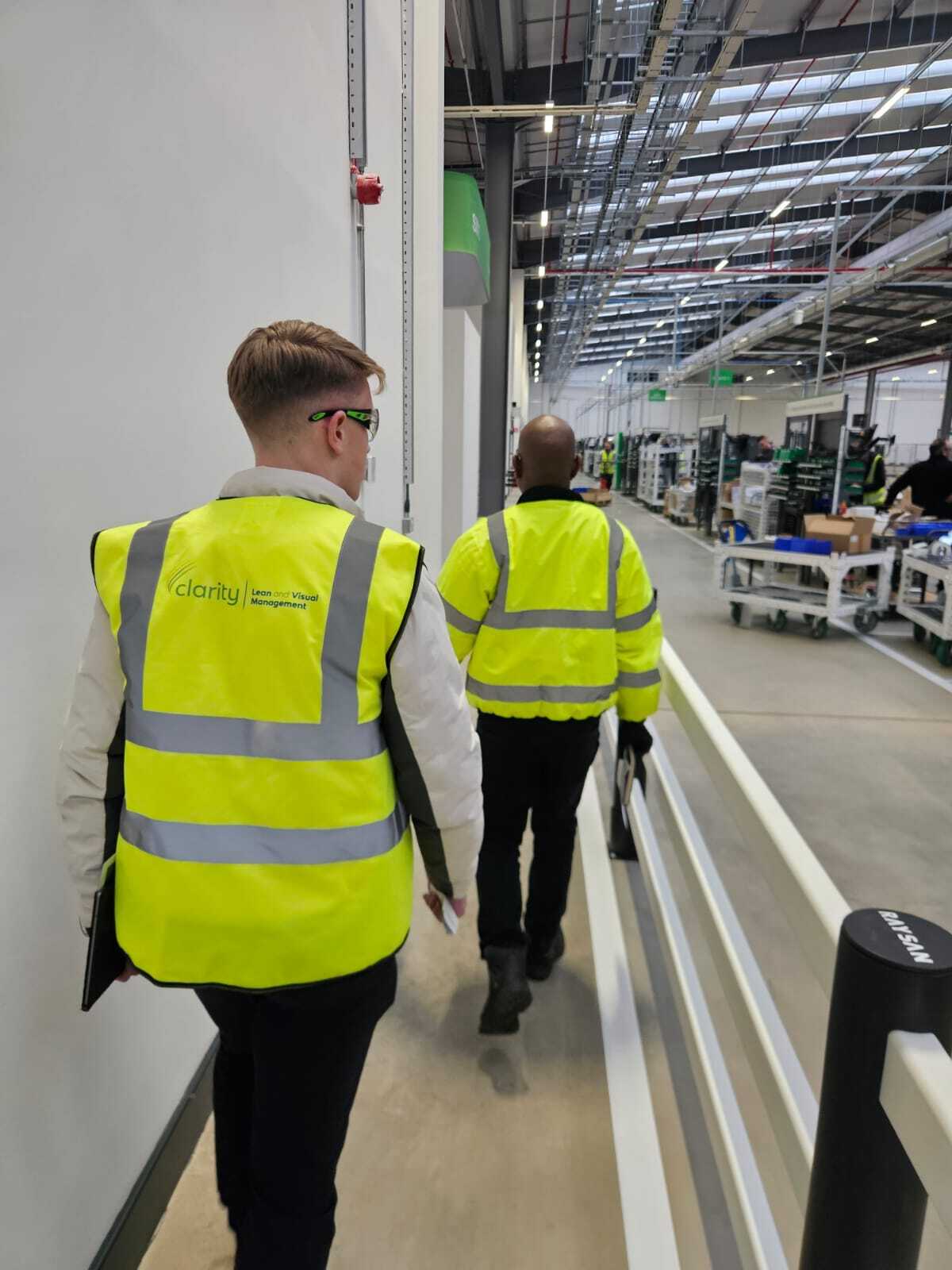 Polymer safety barriers protecting pedestrian walkway in UK warehouse